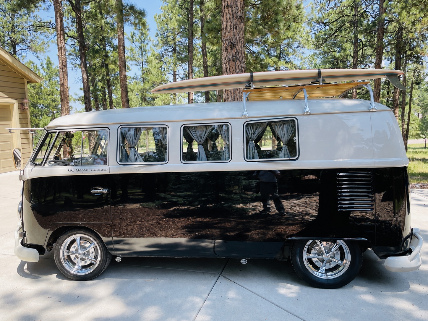 Detailed Volkswagen Safari van with a surfboard on its roof rack